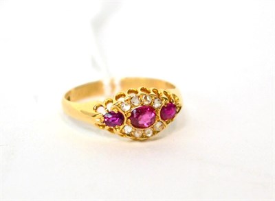 Lot 582 - A ruby and diamond ring, finger size M1/2