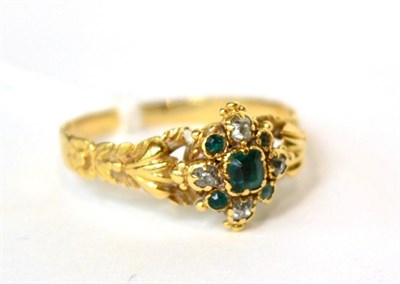 Lot 583 - A Victorian emerald and diamond ring, with floral shoulders, finger size O