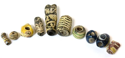 Lot 587 - A collection of ten Egyptian core-formed glass beads, Ptolemaic -Roman period, 4th century...