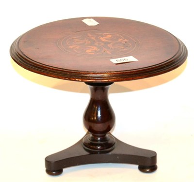 Lot 606 - A miniature inlaid table