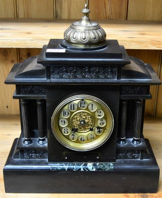 Lot 614 - A black slate and marble mantel striking clock