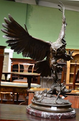 Lot 615 - After J Moigniez, a bronze figure of an owl landing on a branch, on an oval base and marble plinth