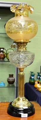 Lot 618 - A Victorian brass oil lamp with clear glass reservoir