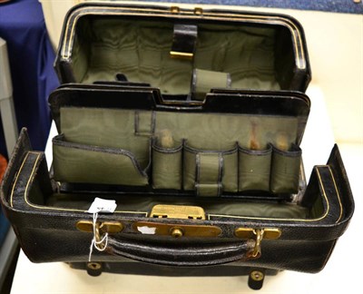 Lot 624 - Mappin and Webb black leather travelling case, in the style of a gladstone bag, with gilt...