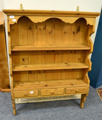 Lot 1063 - A pine draw leaf dining table, together with a pine hanging rack