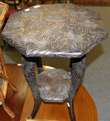 Lot 1064 - An early 20th century carved occasional table