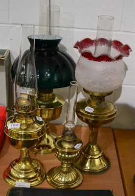 Lot 1108 - Four various brass based oil lamps