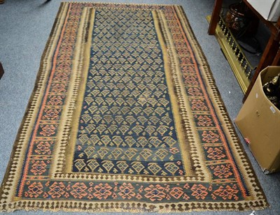 Lot 1136 - North West Persian Kilim, the indigo field of stylised boteh enclosed by compartmentalised borders