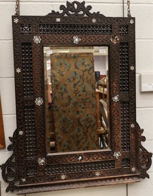 Lot 1139 - An Anglo Indian wall mirror and a brass topped anglo Indian folding table