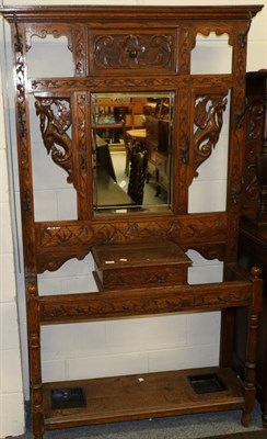 Lot 1150 - Late Victorian carved oak mirrored hall stand