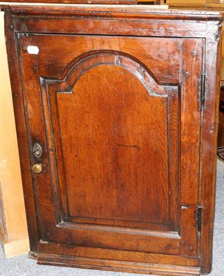 Lot 1155 - An 18th Century oak wall-hanging corner cupboard, 75cm in height