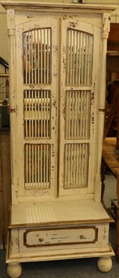 Lot 1164 - A shabby chic hall mirror with grill doors and a base drawer