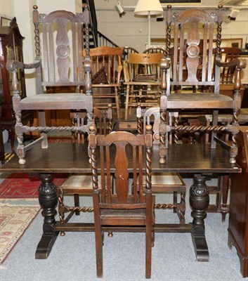 Lot 1180 - An oak table and five chairs