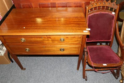 Lot 1197 - An Edwardian side table with two drawers, a Victorian armchair and a folding rocking chair