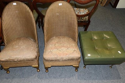 Lot 1199 - Two Lloyd Loom nursing chairs and a large mock leather pouffe/stool, circa 1950