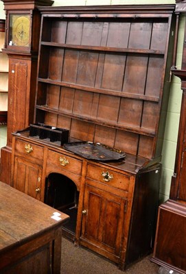 Lot 1208 - An 18th century oak dresser and rack