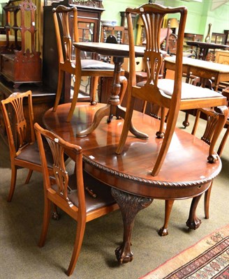 Lot 1228 - A dining table, with additional leaf, together with six chairs