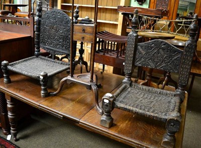 Lot 1244 - A pair of Afghan ceremonial chairs, late 19th/early 20th Century, heavily carved and turned detail