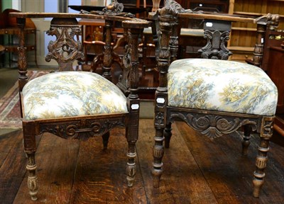 Lot 1247 - Two Victorian carved oak corner chairs