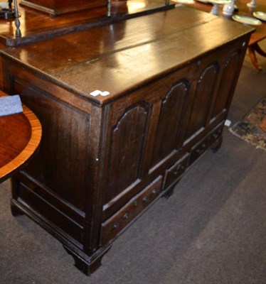 Lot 1257 - A panelled oak mule chest together with a reproduction corner cupboard