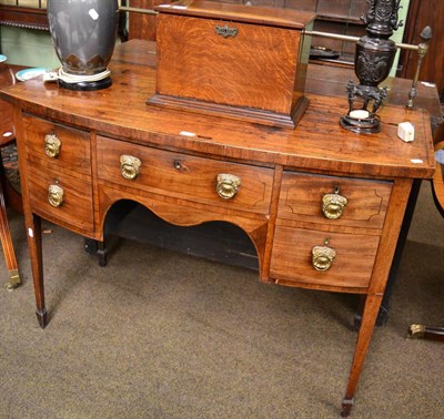 Lot 1259 - A George III mahogany bow fronted sideboard