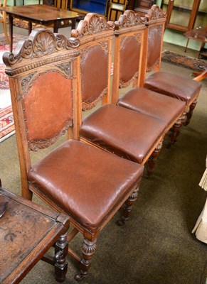 Lot 1260 - A set of four late Victorian/early 20th century leather seated chairs