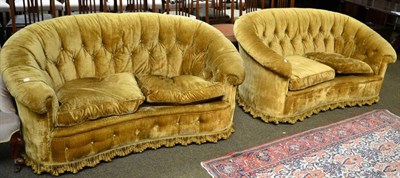 Lot 1270 - A pair of gold velvet two seater sofas