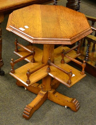 Lot 1296 - An early 20th century oak octagonal occasional table with cross form shelf