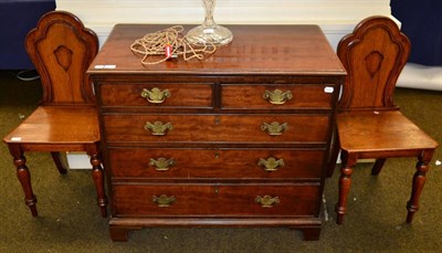 Lot 1301 - A pair of oak shield back plank seated chairs