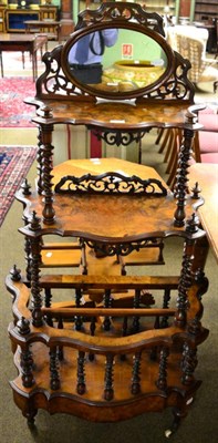 Lot 1304 - A Victorian walnut whatnot with canterbury base