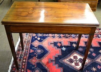 Lot 1308 - A George III mahogany fold over tea table