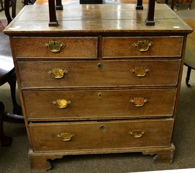 Lot 1315 - A George III provincial oak chest of drawers