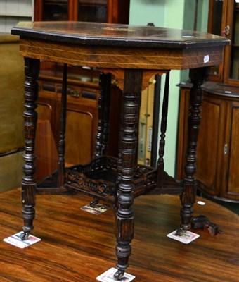 Lot 1331 - A Victorian bow front inlaid plant table