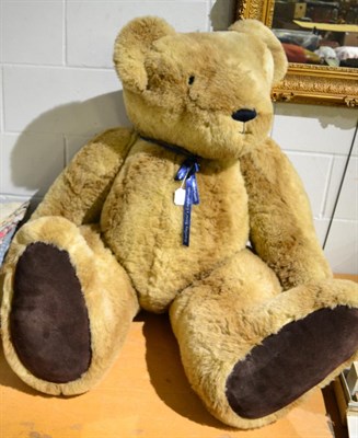 Lot 1400 - A very large jointed Hartley Bear's Emporium teddy bear in light tan plush, dark tan suede paw...