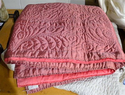 Lot 1408 - Pink satinised reversible quilt 210cm by 240cm; and a modern patchwork quilt with tulip head...