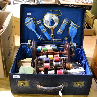 Lot 1427 - Circa 1930s navy dressing case, with cushioned silk lining, brush set in blue enamel, enclosing...