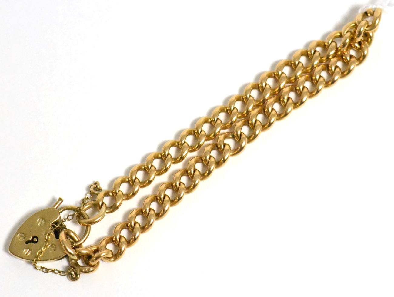 Lot 1 - A 9 carat gold, curb link bracelet with a heart shaped padlock, stamped '375'