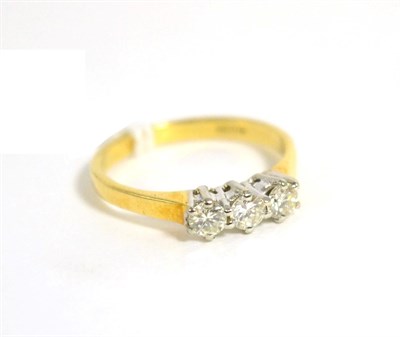 Lot 8 - An 18 carat gold diamond three stone ring