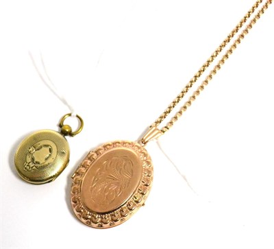 Lot 10 - A 9 carat gold photograph locket, stamped 375, on chain, together with another locket (2)
