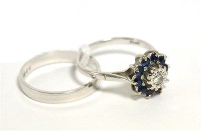 Lot 14 - An 18 carat white gold diamond and sapphire set ring and a 9 carat white gold band ring