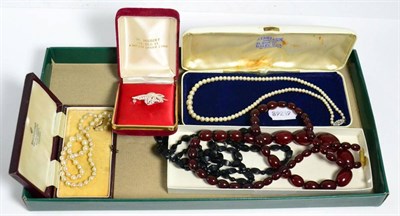 Lot 54 - Two pearl necklaces with clasps stamped 9 carat, black jet necklace, red beaded necklace and a...