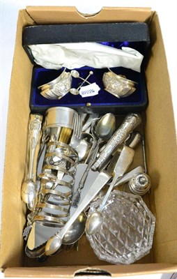 Lot 63 - A mixed group of silver items to include sugar tongs, butter knives, assorted flatware, pepper etc