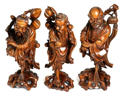 Lot 104 - A group of three Oriental root carvings