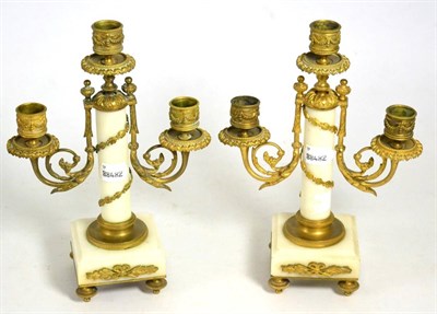 Lot 120 - A pair of marble and gilt metal three light candelabra