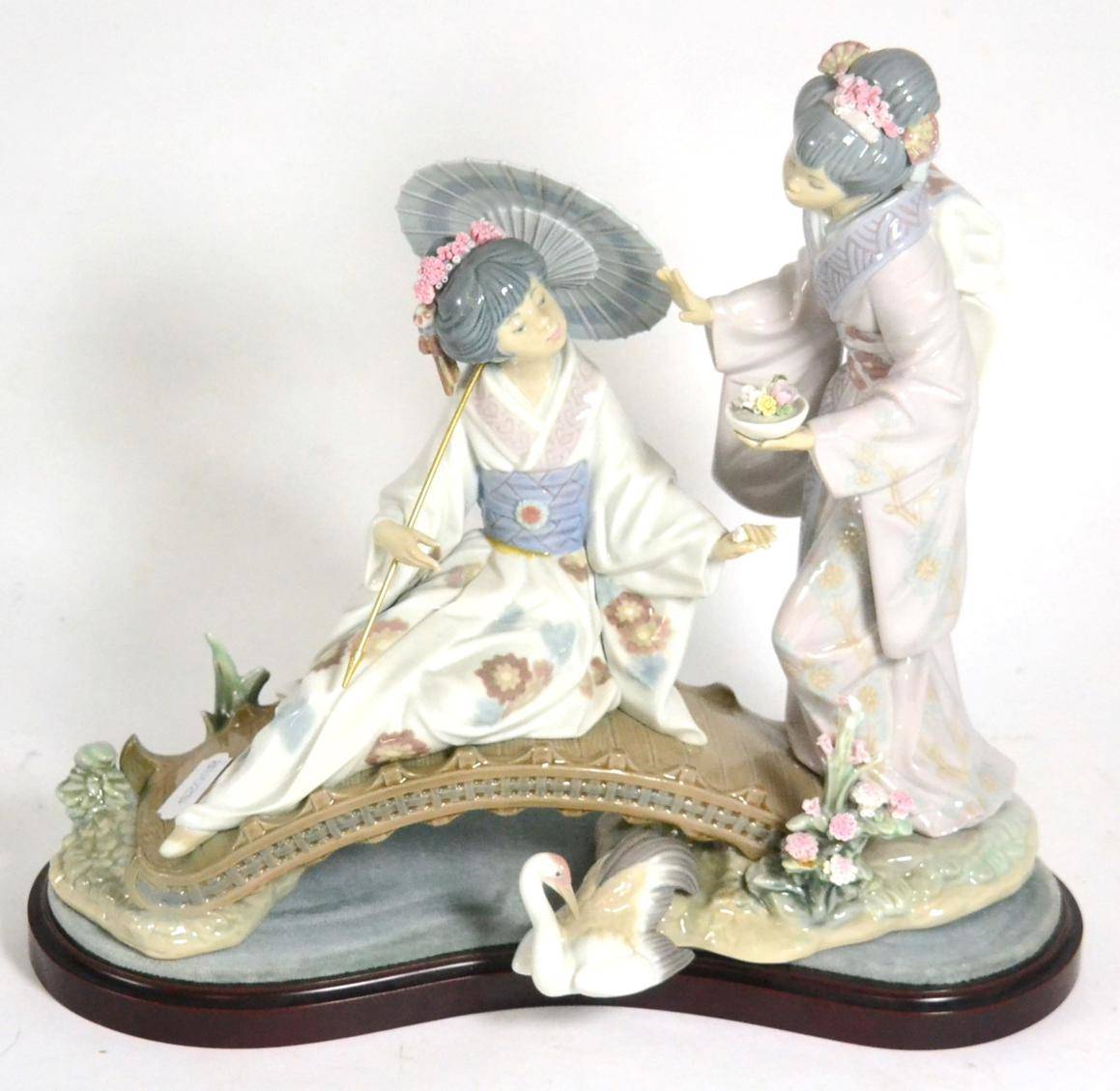 Lot 139 - A Lladro 'Springtime in Japan' figural group and stand (minor losses)