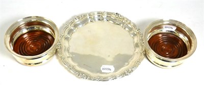 Lot 155 - A pair of modern silver wine coasters, C J Vander, London 1964, and a silver salver, Alexander...