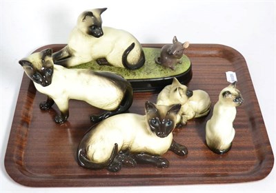 Lot 167 - Beswick Siamese Cats including Lying, model No. 1559A, Standing, model No. 1897 and 'Watch It',...