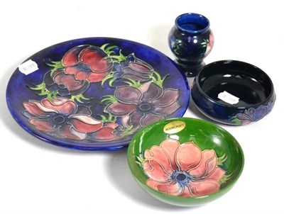 Lot 171 - Moorcroft pottery, two bowls, a vase and a plate all in Anemone pattern