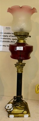 Lot 191 - A Victorian brass lamp with ruby glass reservoir