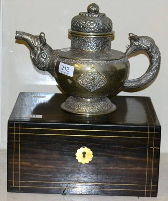 Lot 212 - An Indian white metal teapot